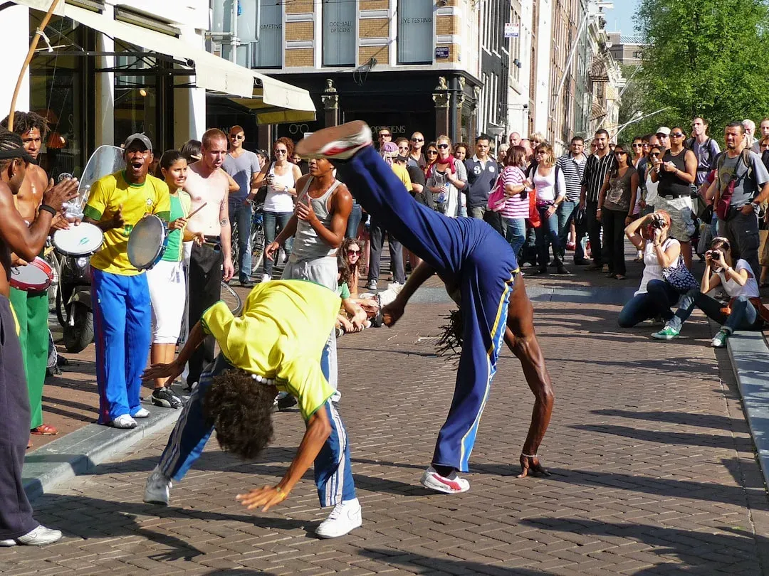 colorful street performers entertaining a lively crowd